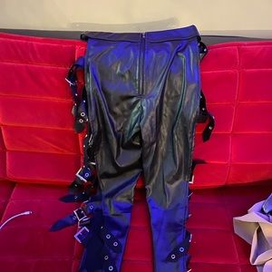 Black leather look pants with buckles on the side to fasten up